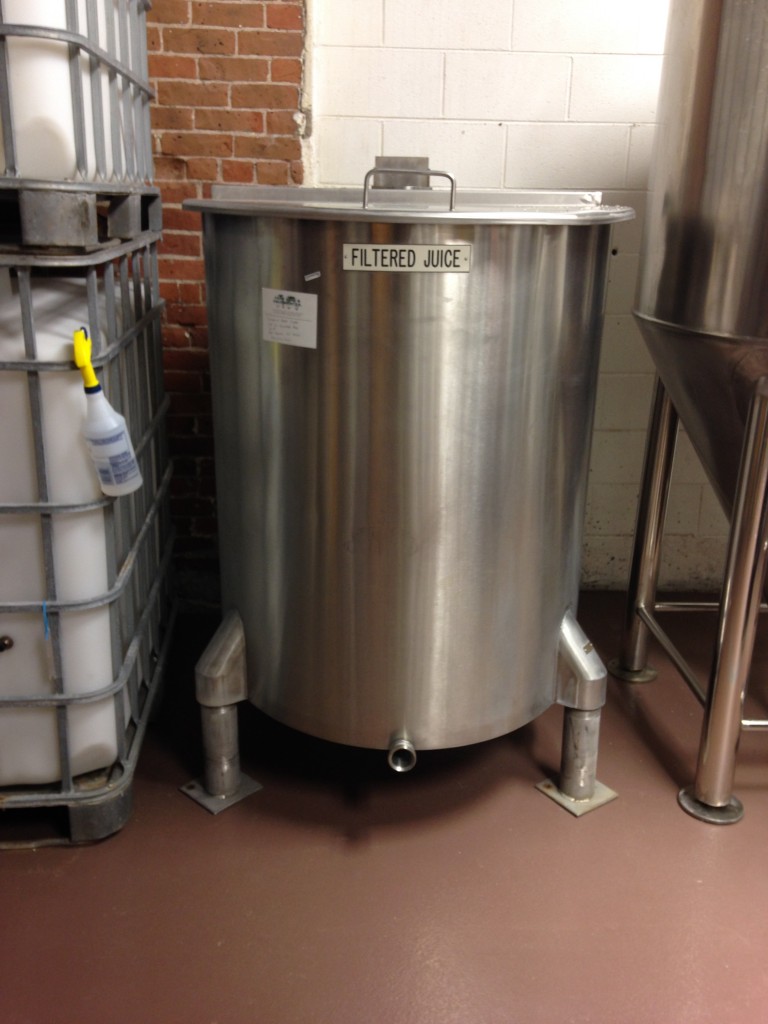 Open-top mixing tank for blending juices pre-fermentation.