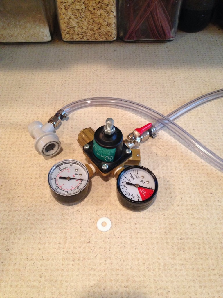 Regulator with connect hose attached at shutoff valve (red); with plastic washer.